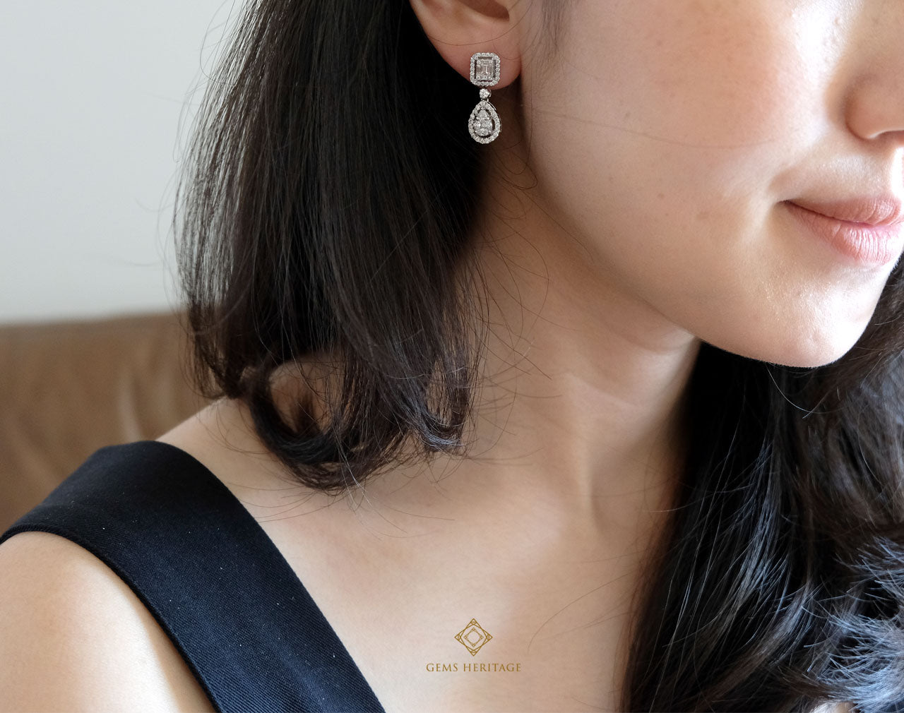 Emerald and pear illusion diamond earrings